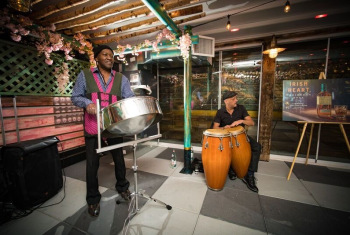 AfriCarib Steeldrum Band playing at indoor venue